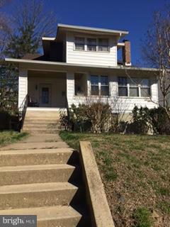 2317 Monticello Road Baltimore, MD 21216 - Photo 1 of 30 a front view of a house with garden
