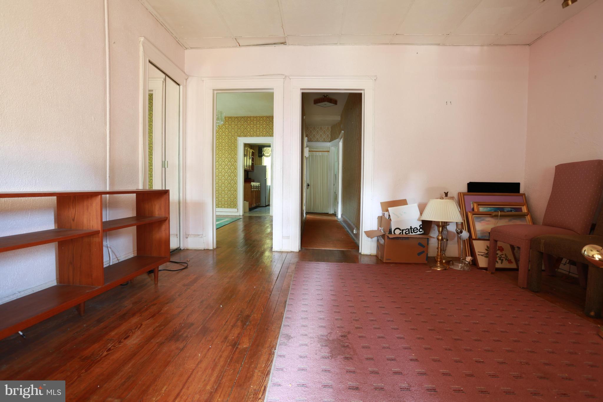 2317 Monticello Road Baltimore, MD 21216 - Photo 24 of 30 a living room with furniture and a wooden floor