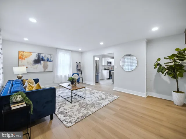 a living room with furniture and a rug