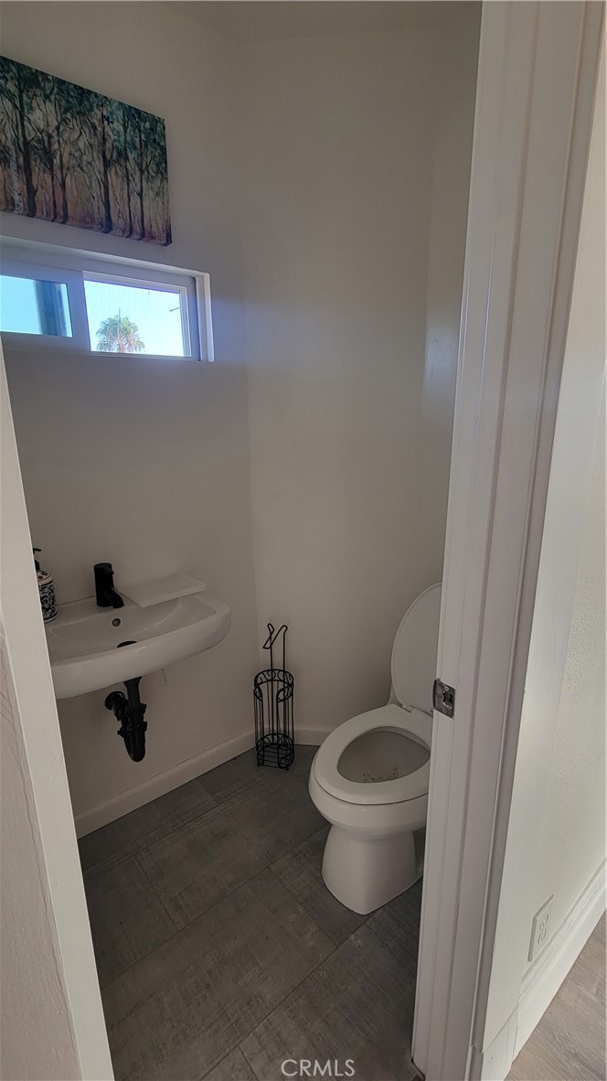503 West Colton Avenue Redlands, CA 92374 - Photo 17 of 18 a bathroom with a toilet and a sink