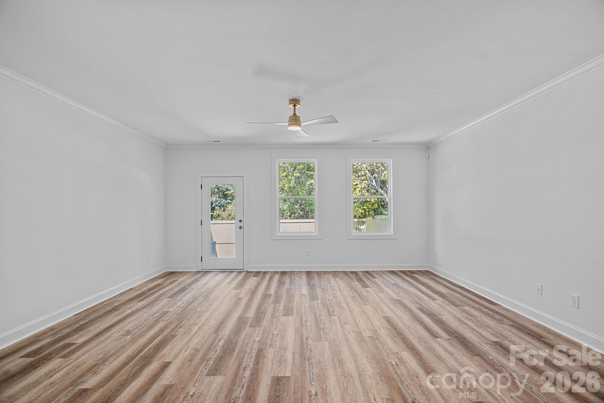 4015 Sofley Road Charlotte, NC 28206 - Photo 15 of 41 wooden floor in an empty room with a window