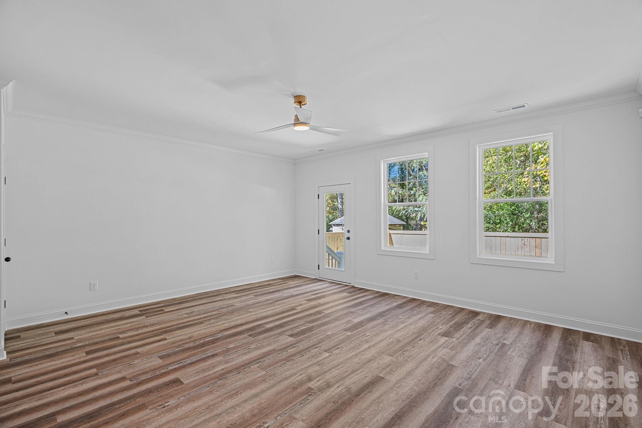 4015 Sofley Road Charlotte, NC 28206 - Photo 16 of 41 a view of an empty room with wooden floor and a window
