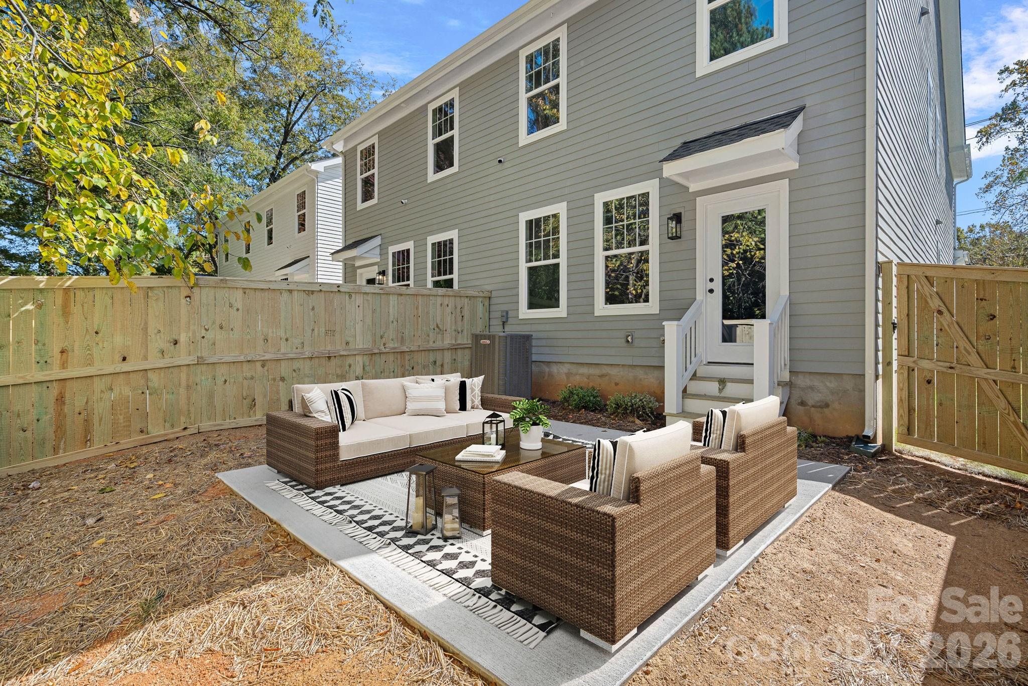 4015 Sofley Road Charlotte, NC 28206 - Photo 17 of 41 a view of a patio with couches chairs and wooden floor