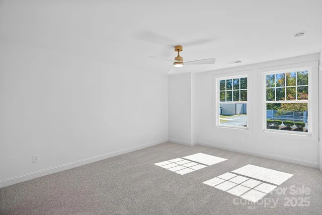 a bathroom with double sink and a mirror
