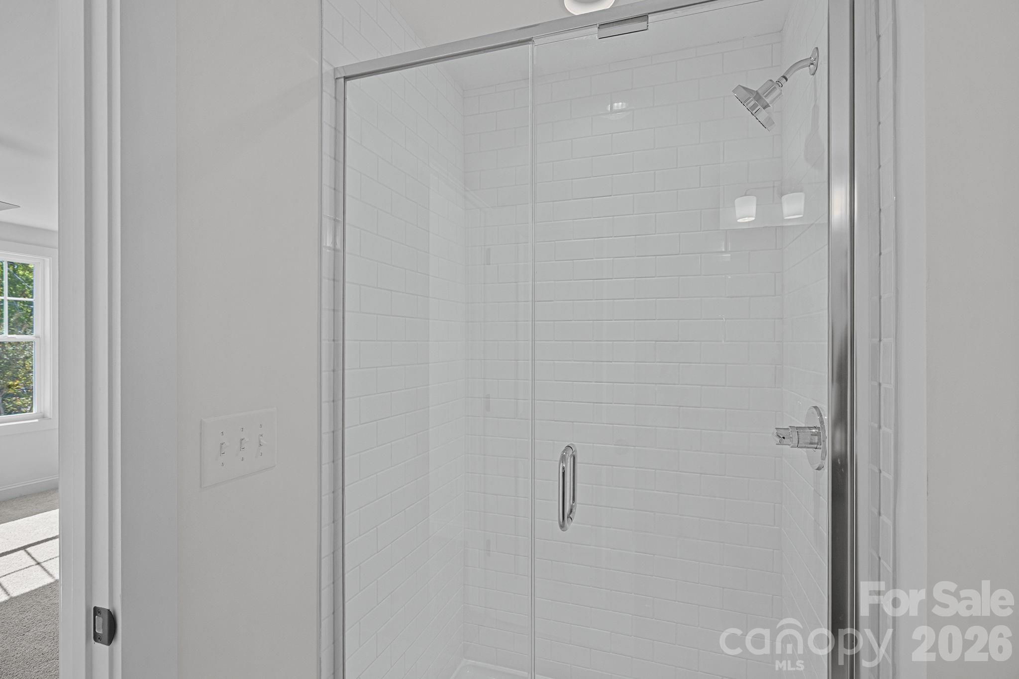 4015 Sofley Road Charlotte, NC 28206 - Photo 24 of 41 a bathroom with a glass shower door