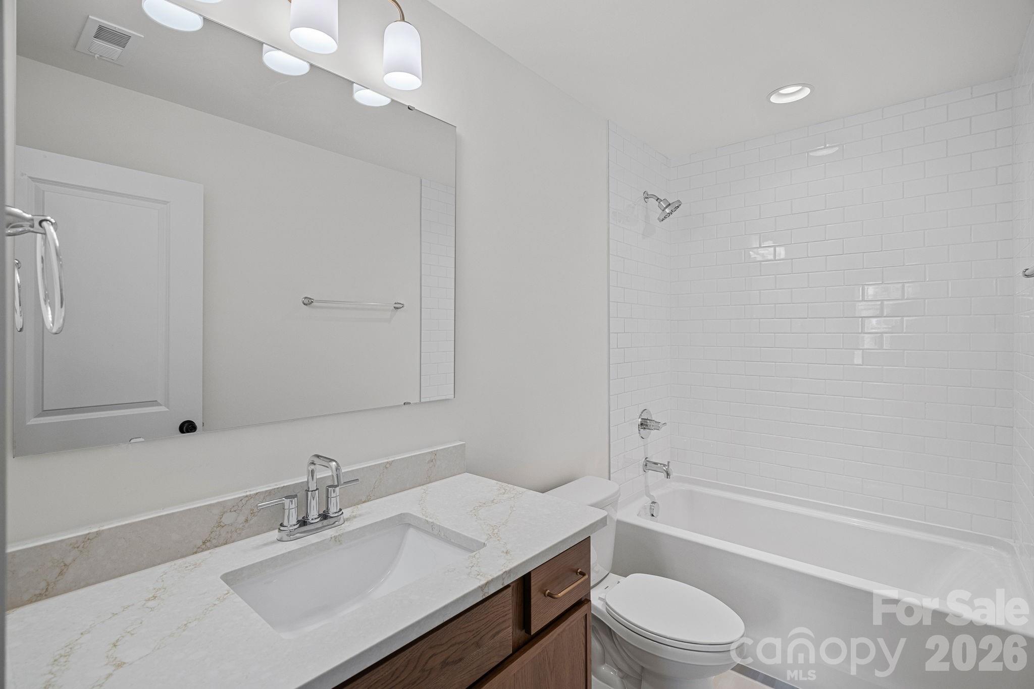 4015 Sofley Road Charlotte, NC 28206 - Photo 26 of 41 a bathroom with a sink a toilet and shower