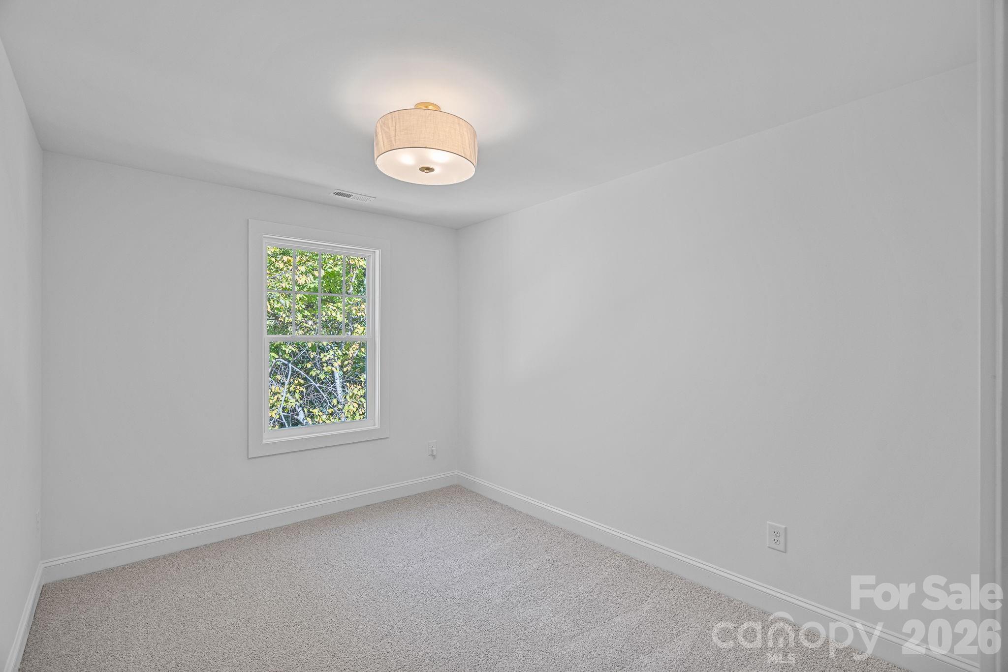 4015 Sofley Road Charlotte, NC 28206 - Photo 27 of 41 an empty room with windows