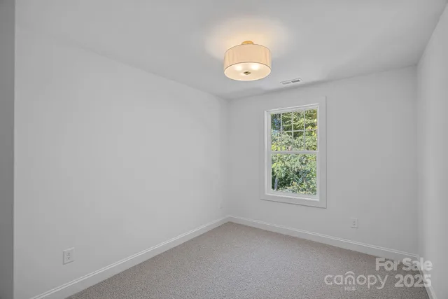 a view of hallway with closet