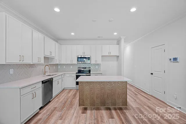 a large kitchen with cabinets