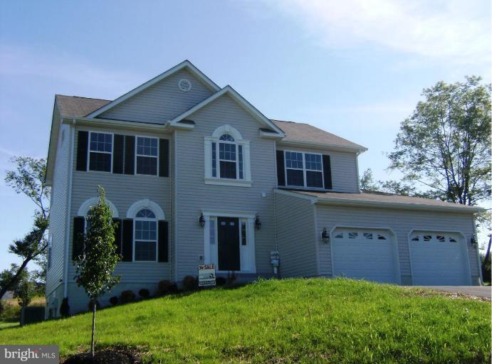 783 Rivanna Run Falling Waters, WV 25419 - Photo 4 of 30 a front view of house with yard and green space