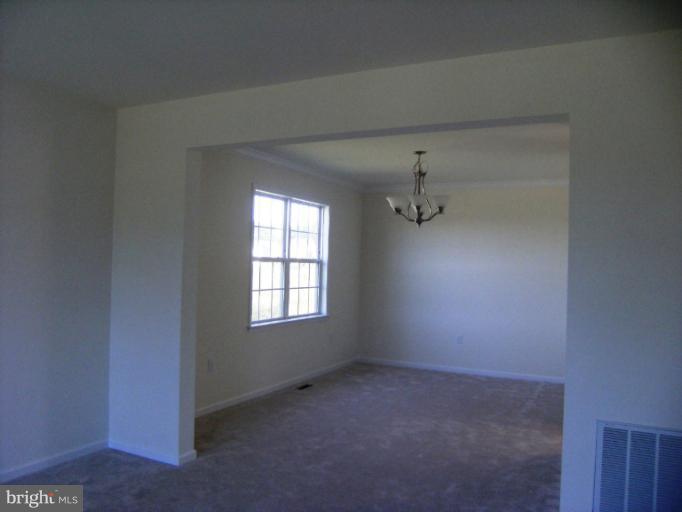 783 Rivanna Run Falling Waters, WV 25419 - Photo 9 of 30 an empty room with windows