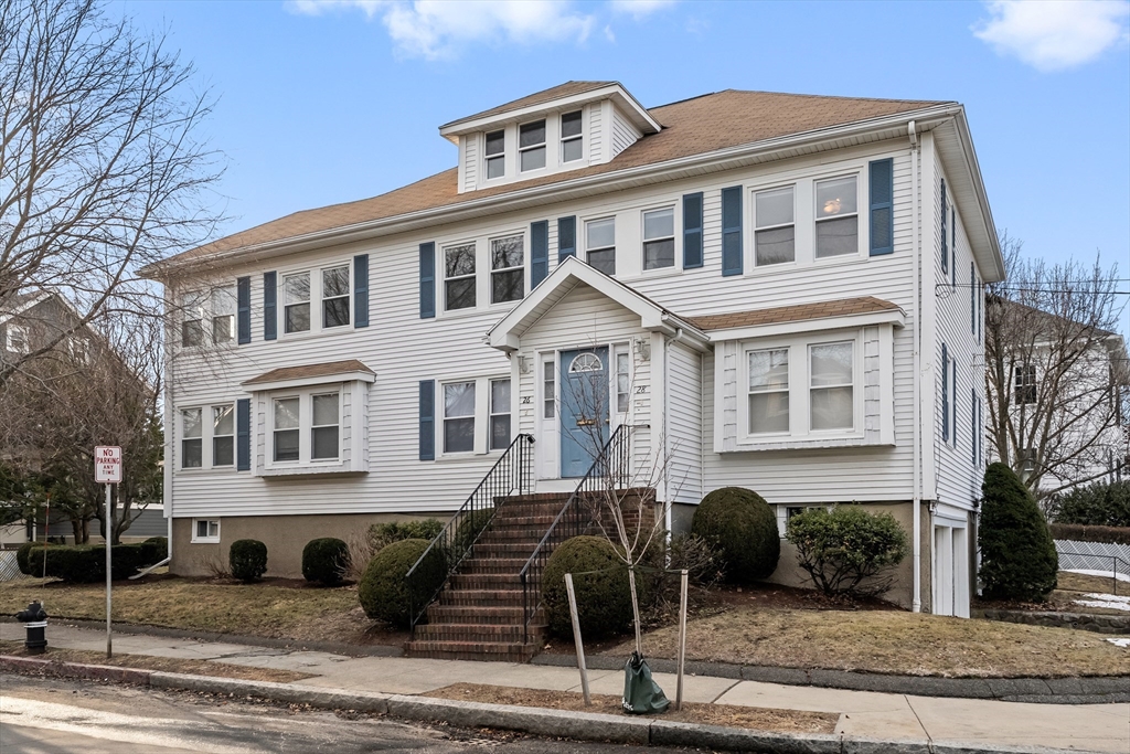26-28 Alton Street Arlington, MA 02474 - Photo 1 of 41 a front view of a house with a yard