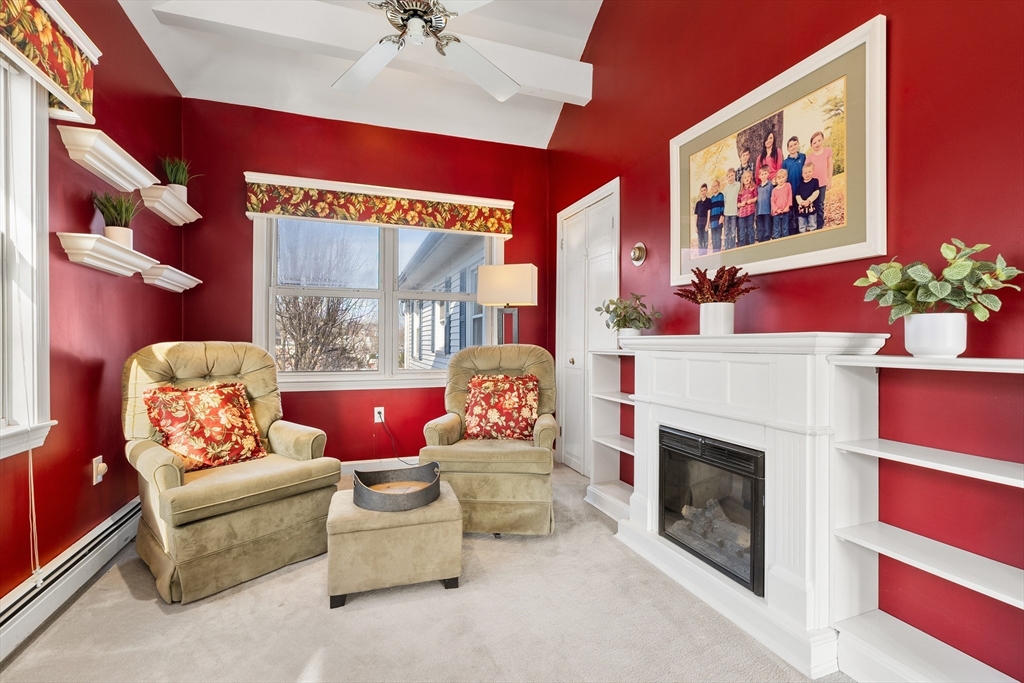 26-28 Alton Street Arlington, MA 02474 - Photo 13 of 41 a living room with furniture and a fireplace