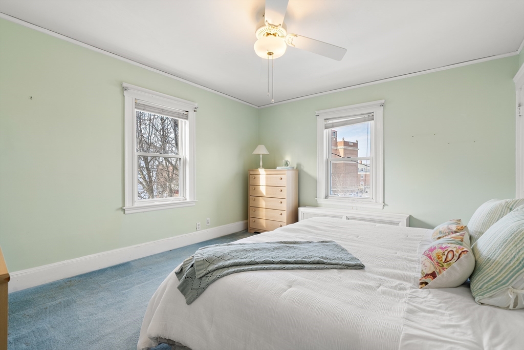 26-28 Alton Street Arlington, MA 02474 - Photo 17 of 41 a bedroom with a bed and a window