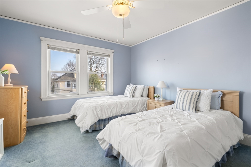26-28 Alton Street Arlington, MA 02474 - Photo 18 of 41 a bedroom with two beds and a chandelier