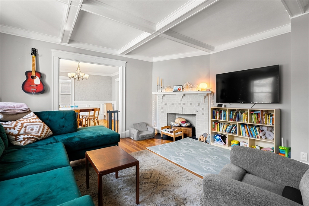 26-28 Alton Street Arlington, MA 02474 - Photo 24 of 41 a living room with furniture and a flat screen tv