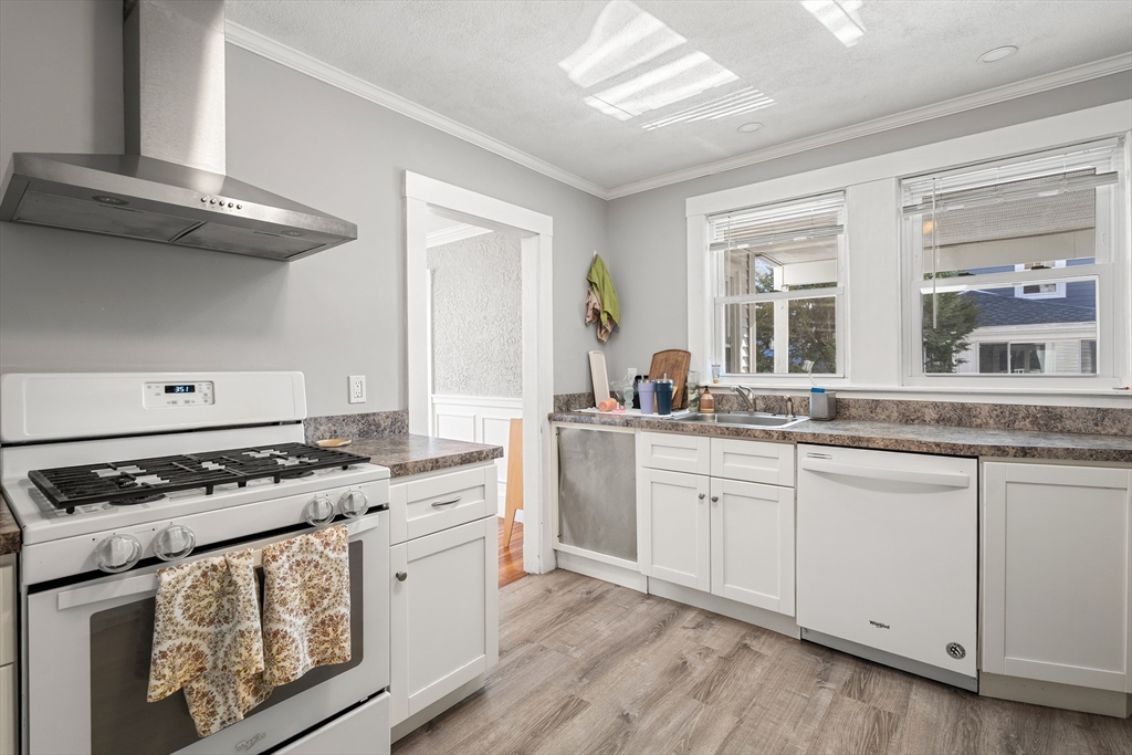 26-28 Alton Street Arlington, MA 02474 - Photo 29 of 41 a kitchen with stainless steel appliances granite countertop a stove and a sink