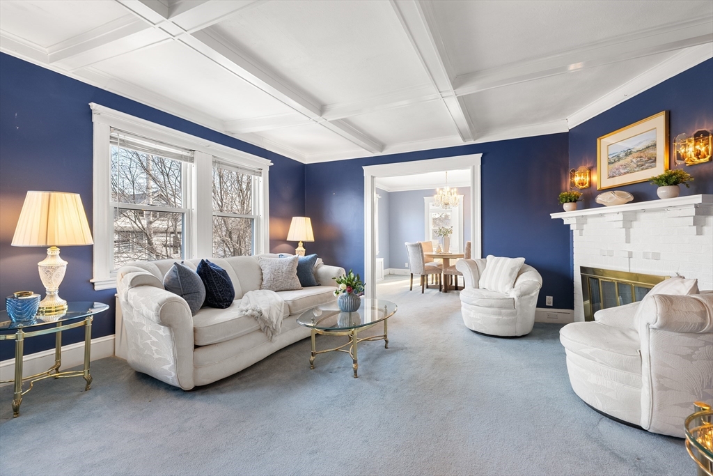 26-28 Alton Street Arlington, MA 02474 - Photo 3 of 41 a living room with fireplace furniture and a large window