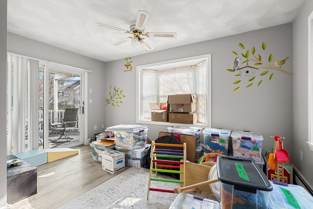 26-28 Alton Street Arlington, MA 02474 - Photo 32 of 41 a bedroom with furniture and a window