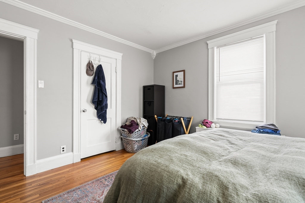 26-28 Alton Street Arlington, MA 02474 - Photo 36 of 41 a bedroom with a bed and a window