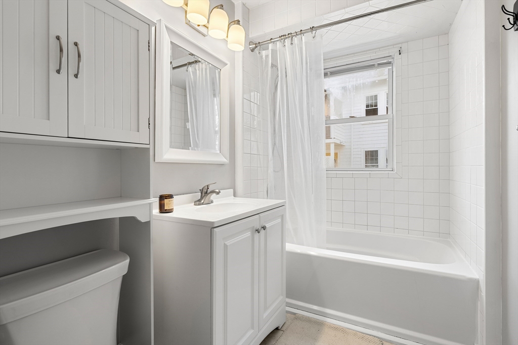 26-28 Alton Street Arlington, MA 02474 - Photo 39 of 41 a bathroom with a sink a toilet and a bathtub