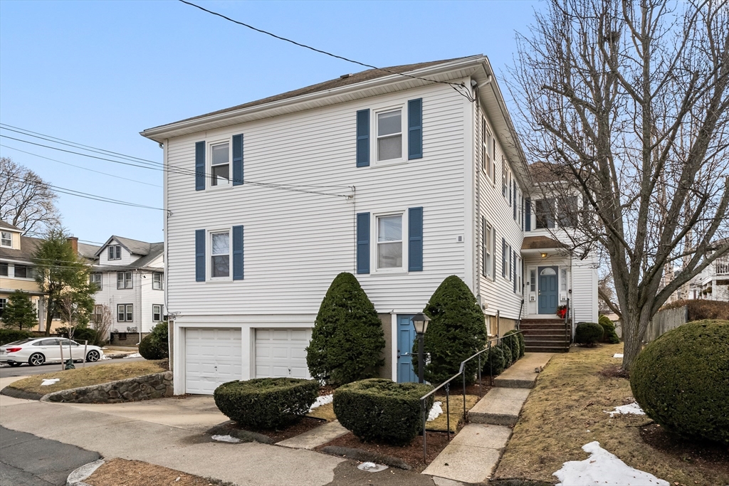 26-28 Alton Street Arlington, MA 02474 - Photo 41 of 41 a front view of a house with garden