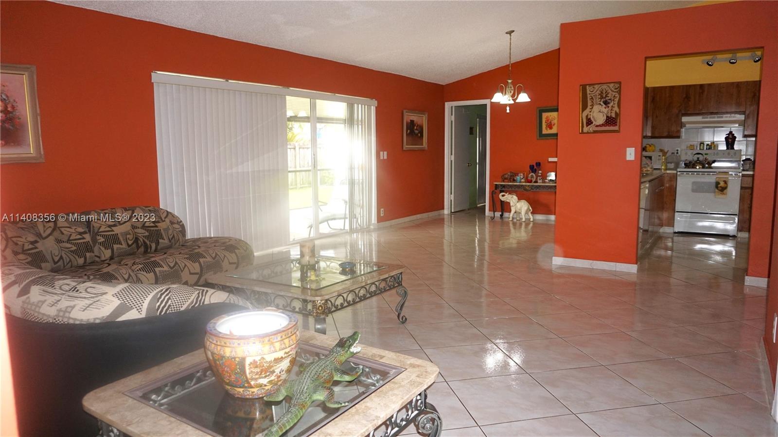 9099 Gettysburg Road Boca Raton, FL 33434 - Photo 3 of 25 a living room with furniture and a wooden floor