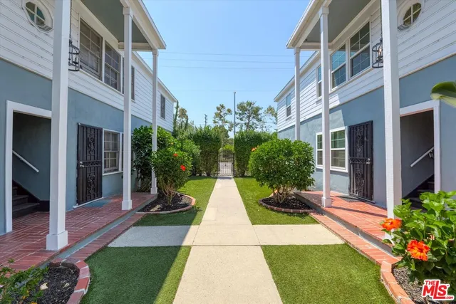 a view of a building with a yard