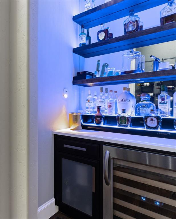 2257 Hermitage Drive Allen, TX 75013 - Photo 11 of 40 a room with lots of wooden racks