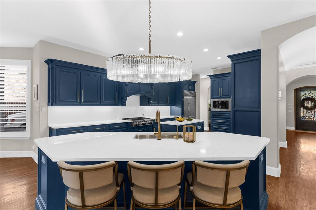 2257 Hermitage Drive Allen, TX 75013 - Photo 14 of 40 a kitchen with a table and chairs in it