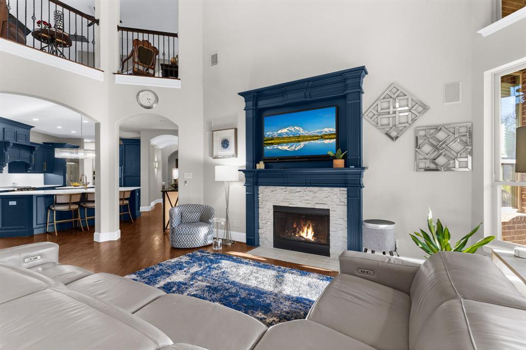 2257 Hermitage Drive Allen, TX 75013 - Photo 18 of 40 a living room with furniture and a fireplace
