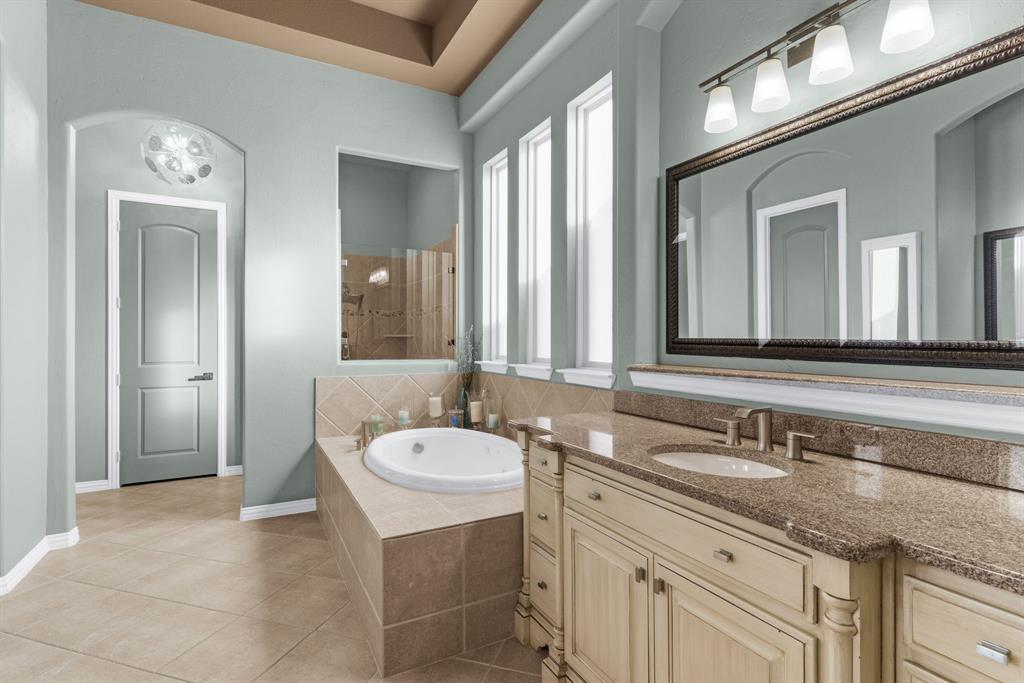 2257 Hermitage Drive Allen, TX 75013 - Photo 23 of 40 a bathroom with a granite countertop sink and a mirror