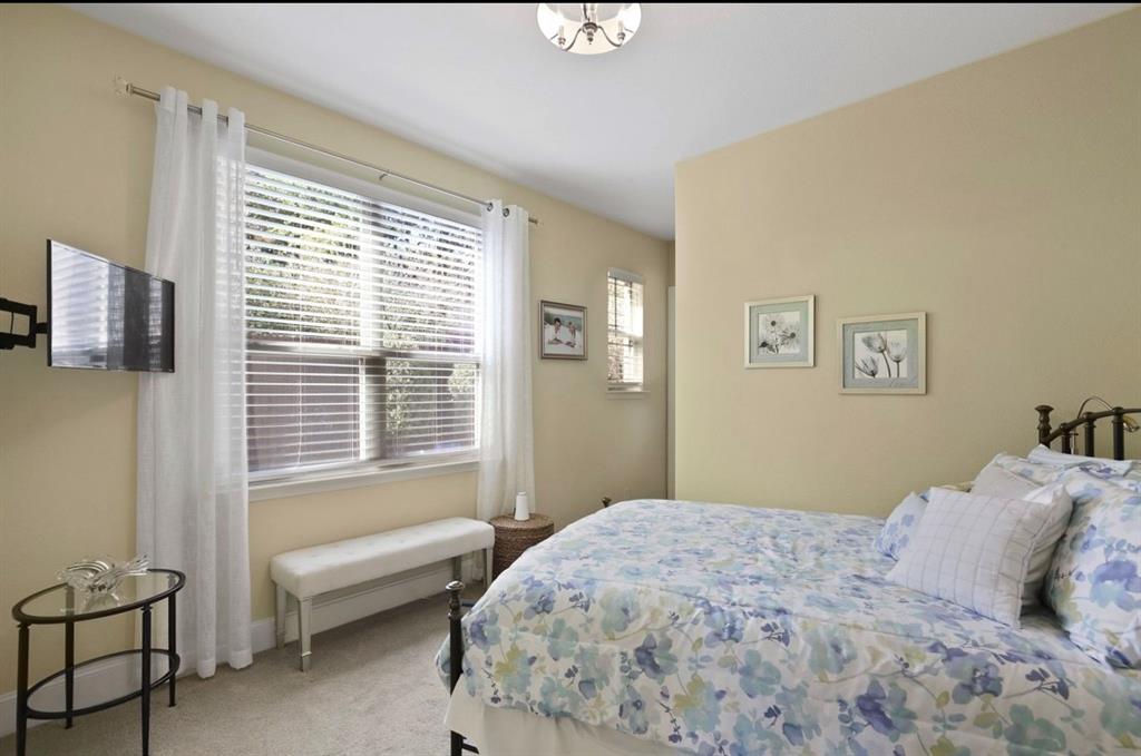 2257 Hermitage Drive Allen, TX 75013 - Photo 28 of 40 a bedroom with a bed and a window