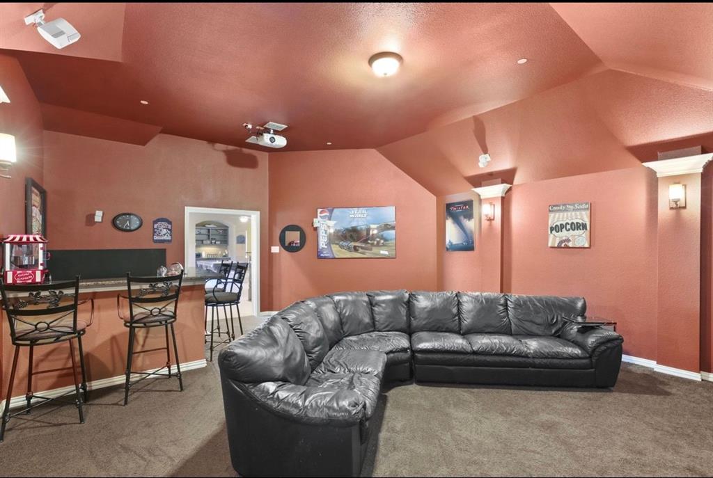 2257 Hermitage Drive Allen, TX 75013 - Photo 33 of 40 a living room with furniture and a flat screen tv