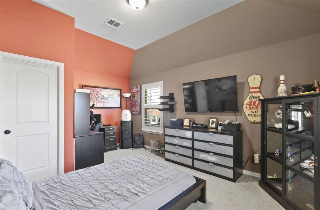 2257 Hermitage Drive Allen, TX 75013 - Photo 34 of 40 a bedroom with a bed furniture and a flat tv screen