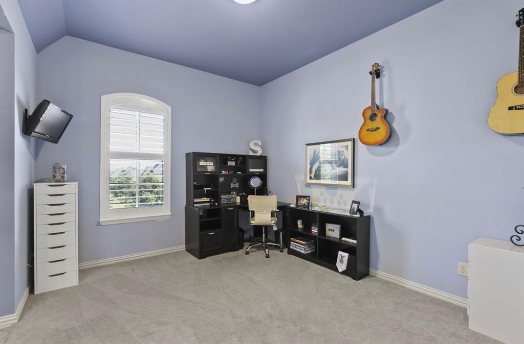 2257 Hermitage Drive Allen, TX 75013 - Photo 36 of 40 a view of an empty room with a window and storage