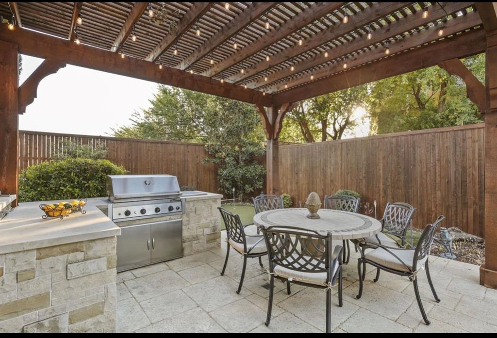 2257 Hermitage Drive Allen, TX 75013 - Photo 4 of 40 a table and chairs in a patio