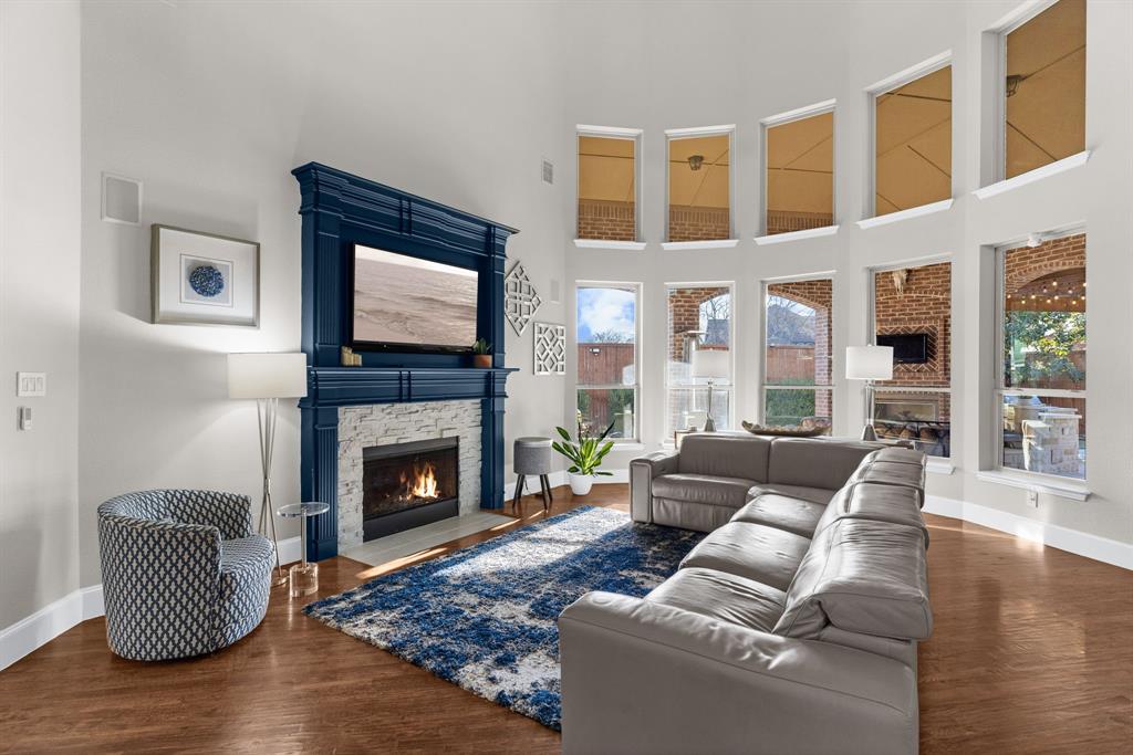 2257 Hermitage Drive Allen, TX 75013 - Photo 6 of 40 a living room with furniture and a fireplace