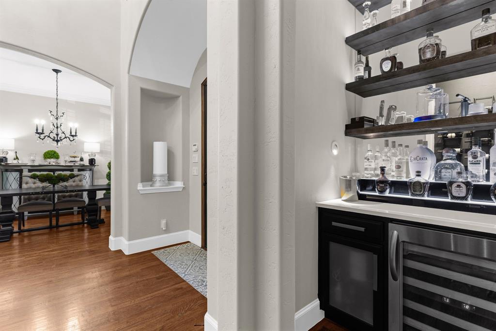 2257 Hermitage Drive Allen, TX 75013 - Photo 10 of 40 a kitchen with stainless steel appliances granite countertop a sink and cabinets