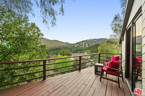 a kitchen with stainless steel appliances granite countertop a sink a stove and refrigerator