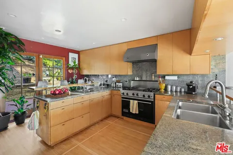 a view of a chairs and table in the patio