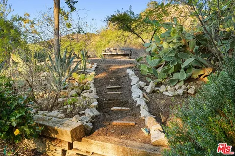 a bed room with a bed and a chair