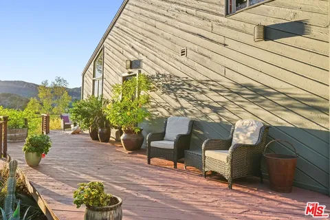 a bathroom with a sink mirror toilet and shower