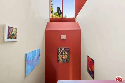 a bedroom with a bed and a view of bathroom