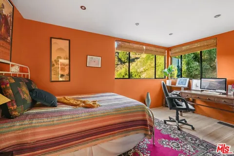 a bed room with a bed and a couch