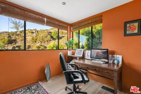 a view of a door and a window