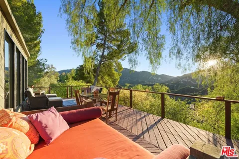 a view of an outdoor dining space with furniture