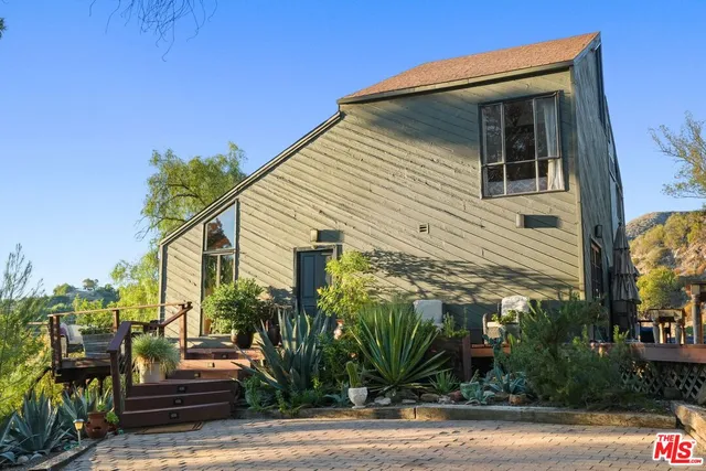 a very nice looking room with a large window and furniture