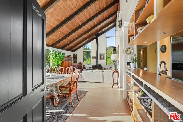 a view of a two chairs and table in the balcony