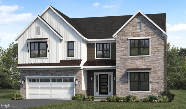 a front view of a house with garage and garage